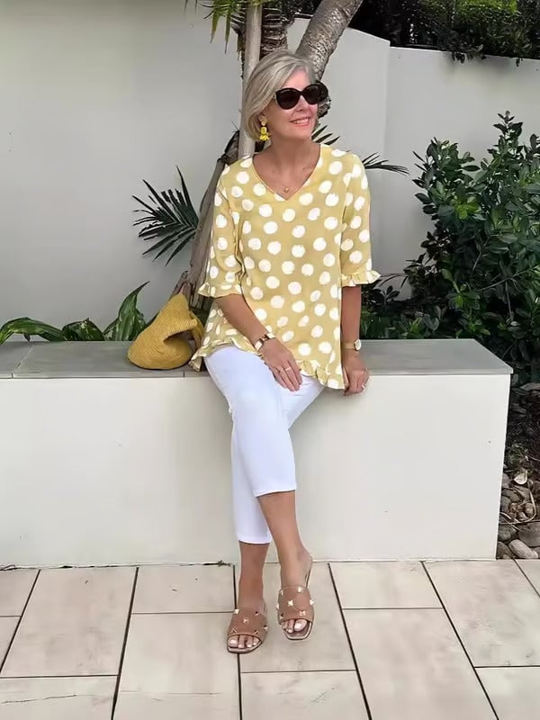 Front view of the Beth V-neck polka dot blouse in sky blue showing the flattering neckline detail