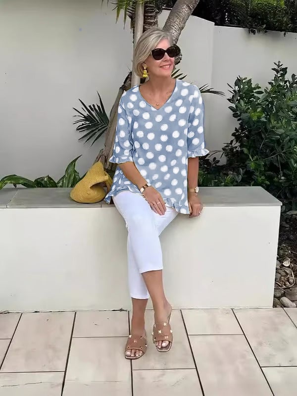 Beth polka dot blouse in candy pink displayed to show color and print detail