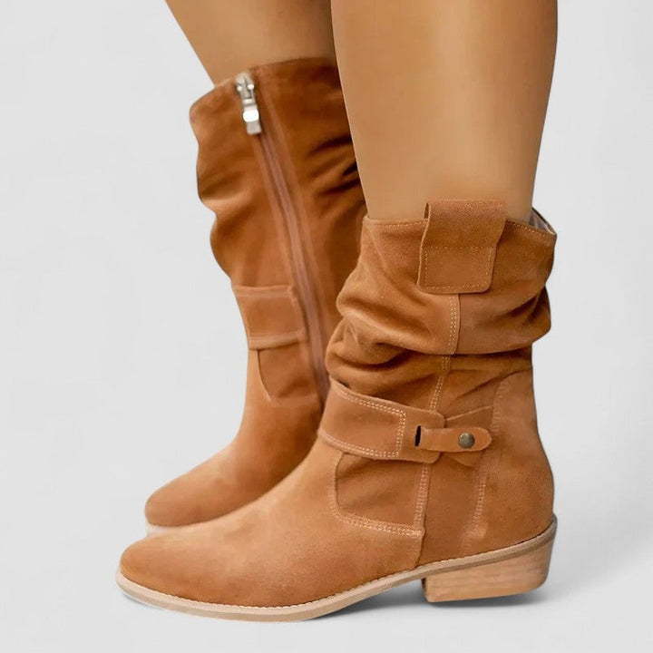 Woman walking in Betha supportive orthopedic boots on a city sidewalk