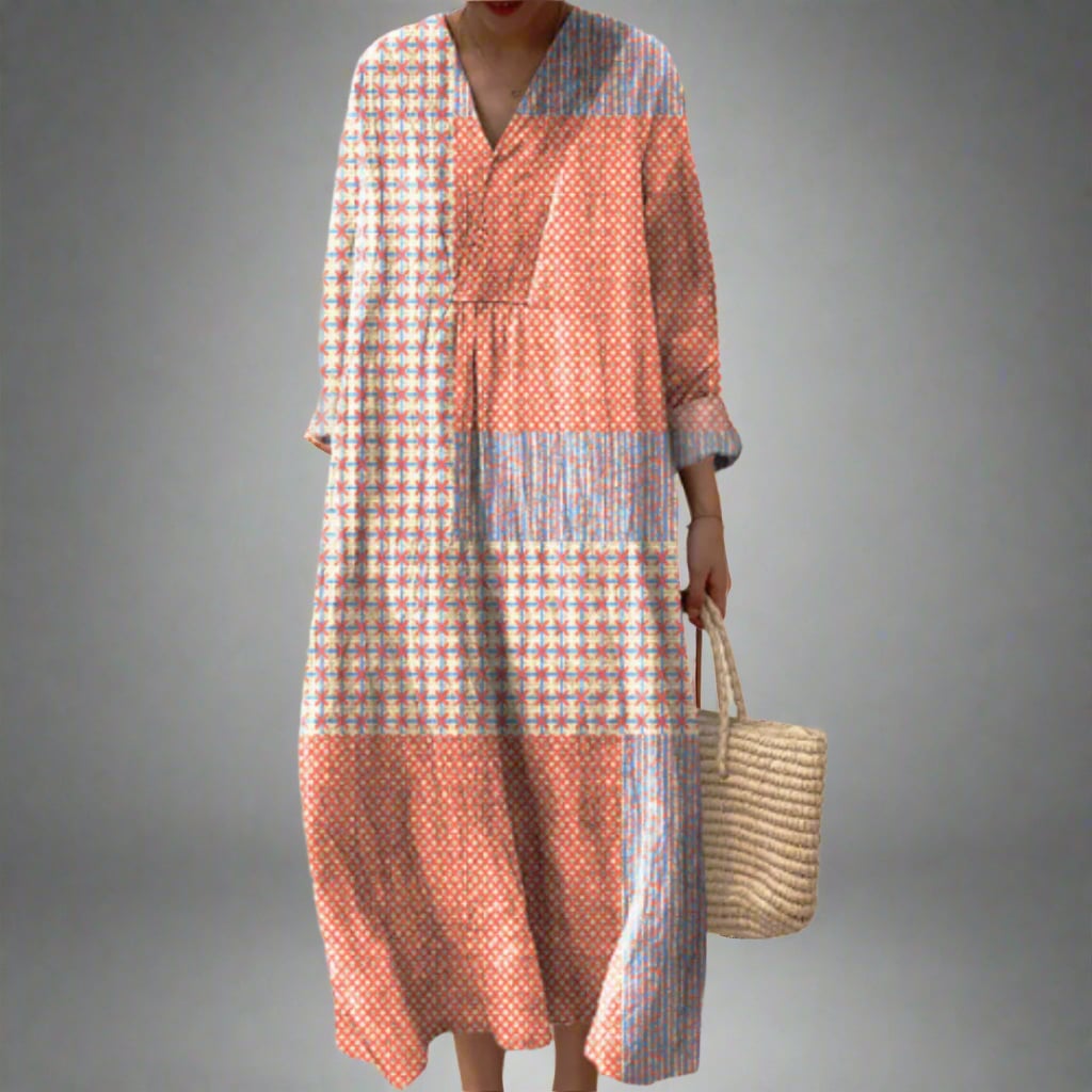Model wearing the Bethany elegant geometric print dress with a fluid, flattering silhouette in a bold dream-inspired pattern