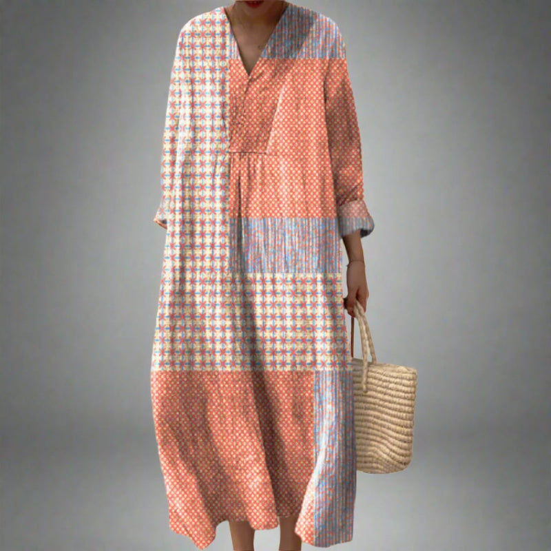 Model wearing the Bethany elegant geometric print dress with a fluid, flattering silhouette in a bold dream-inspired pattern
