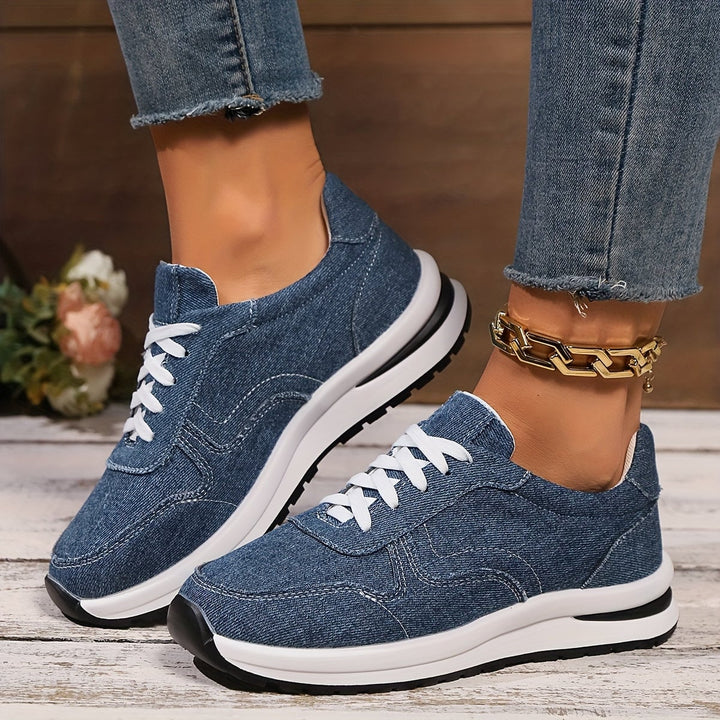 Front view of blue denim orthopedic sneakers with wide toe box and cushioned sole
