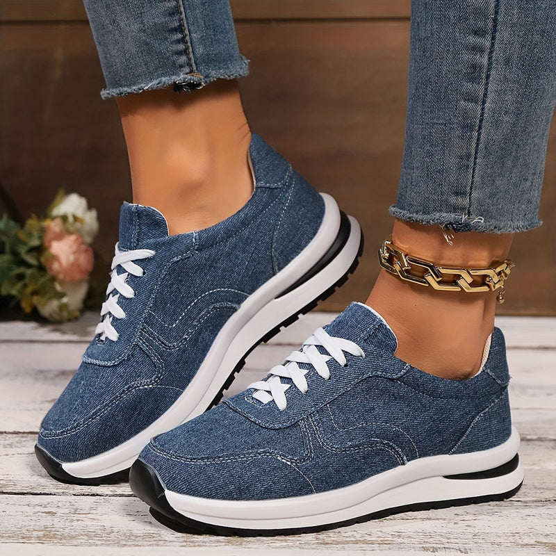 Front view of blue denim orthopedic sneakers with wide toe box and cushioned sole