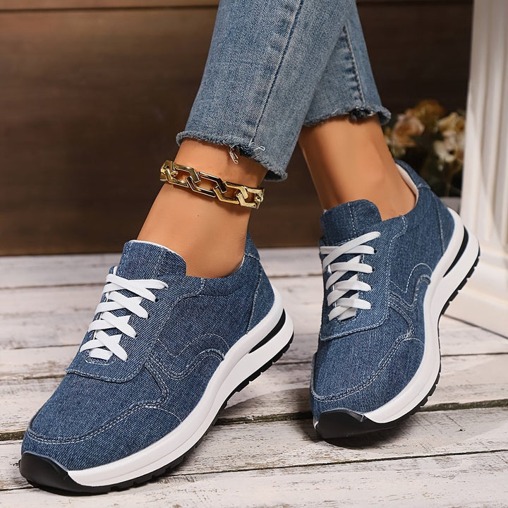 Lifestyle shot of women's blue denim orthopedic sneakers worn with casual outfit