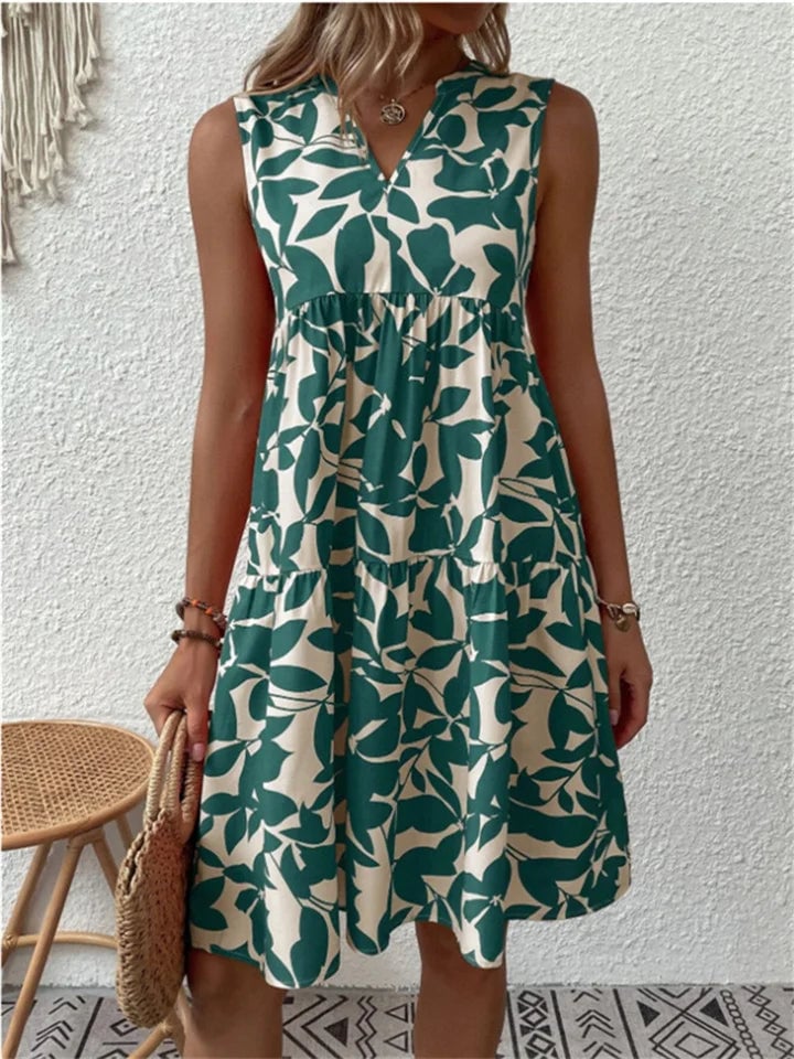 Woman wearing the Beverly blooming flowy dress in a soft, fluid silhouette perfect for warm summer days