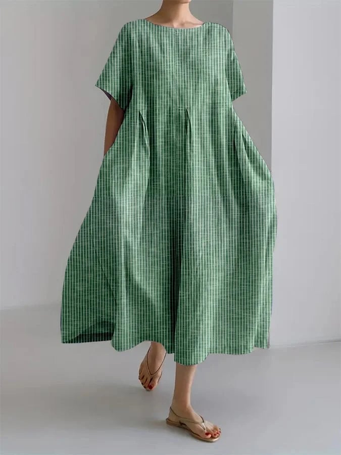 Model styled in the Bianca long dress in green paired with sandals for a casual summer look