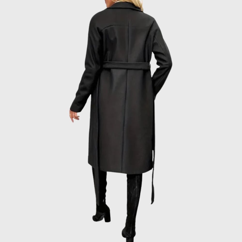 Back view of black longline winter trench coat showing full-length silhouette and clean tailored finish