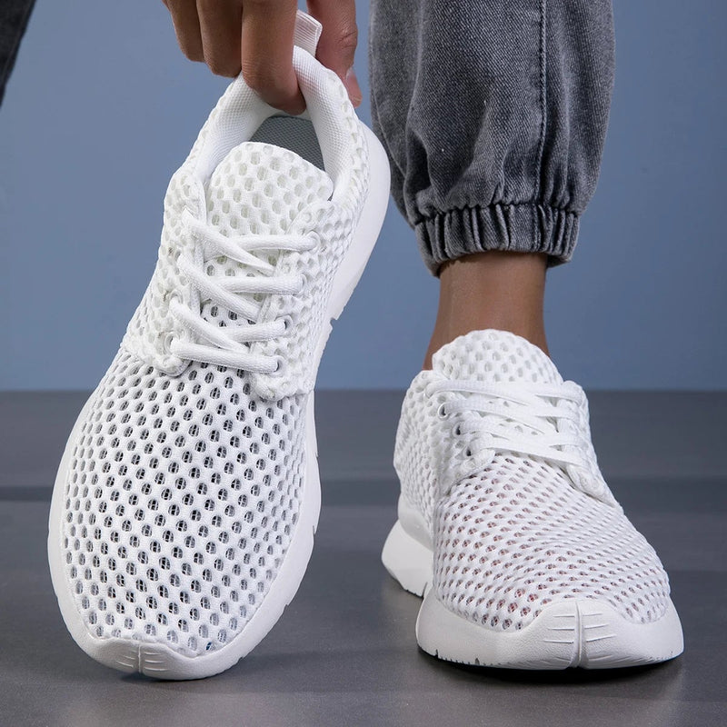 Bianca women's white sneaker on foot, lifestyle walking shot