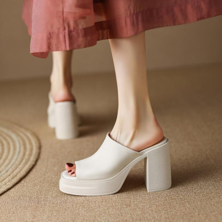 Bianca women's platform flat sandals in white, front view with clean minimalist straps