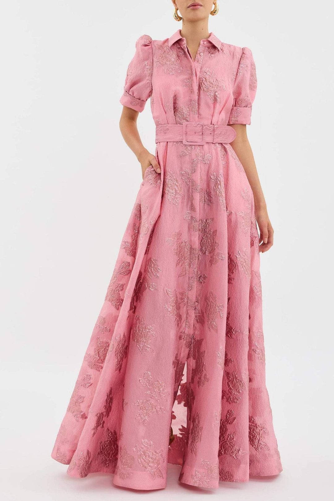 Woman wearing the Bianca soft pink high-waist retro dress with a chic lapel neckline, front view