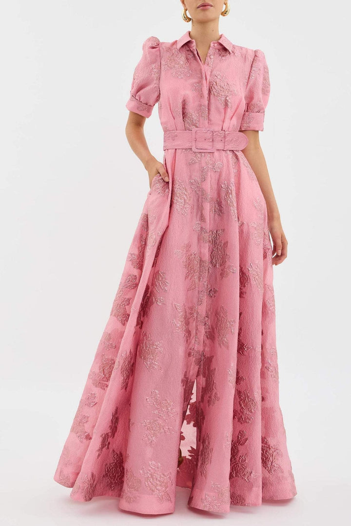 Woman wearing the Bianca soft pink high-waist retro dress with a chic lapel neckline, front view