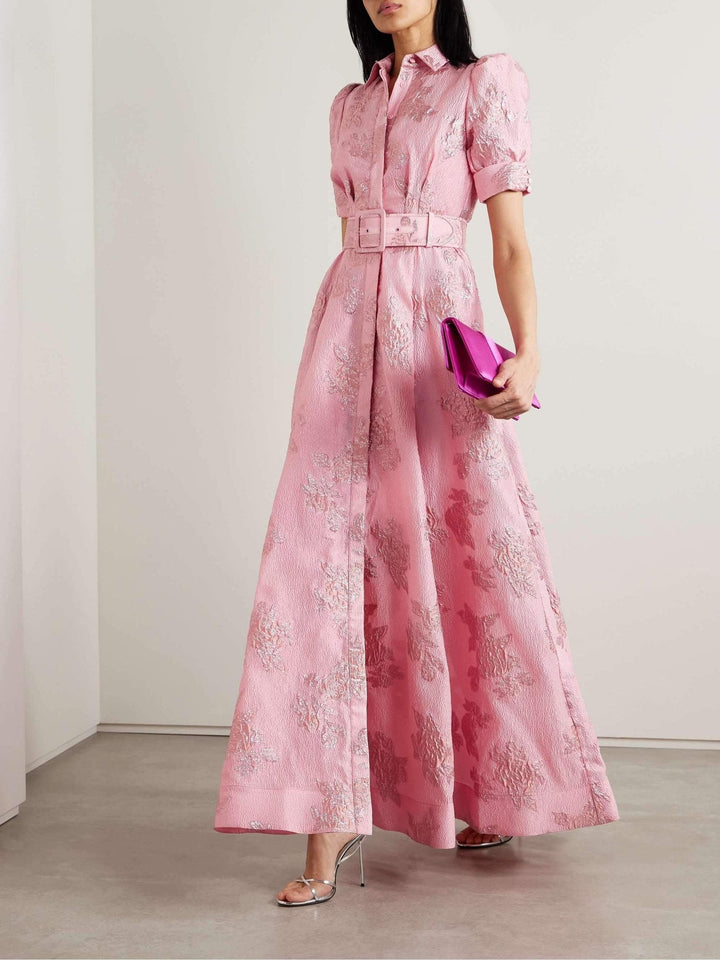 Full-length lifestyle shot of model in the Bianca retro pink dress styled for a special occasion