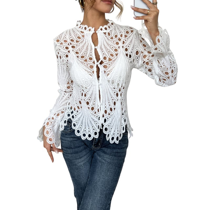 Woman wearing the Bianca off white lace cutwork blouse with lantern sleeves and scalloped hem, front view
