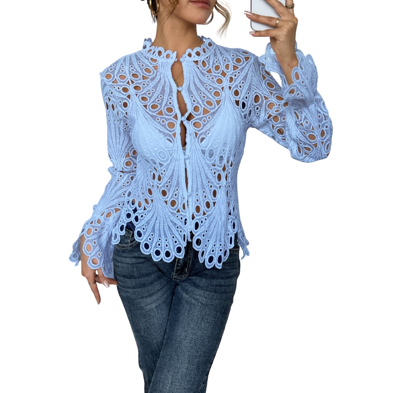 Side view of the Bianca lace blouse showing tie-front neckline and flared lantern sleeve silhouette