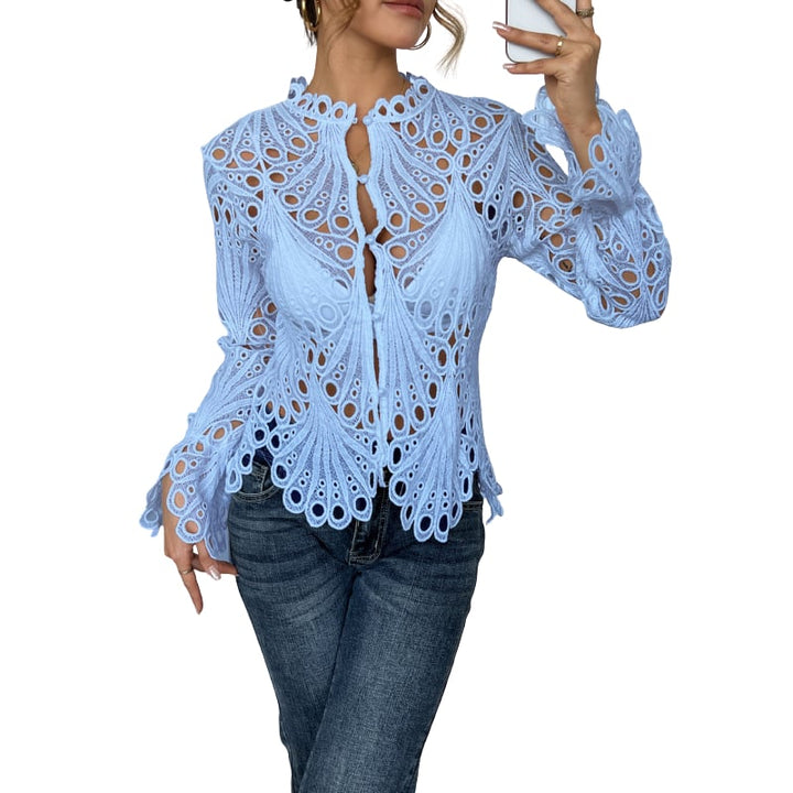 Side view of the Bianca lace blouse showing tie-front neckline and flared lantern sleeve silhouette