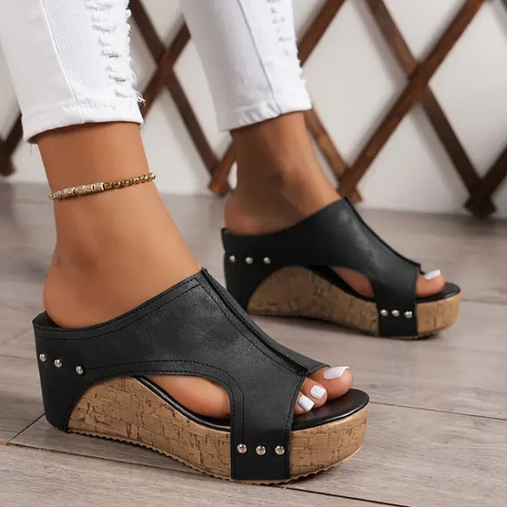 Birdie women's orthopedic cushioned sandal in black with contoured footbed and adjustable straps, side view