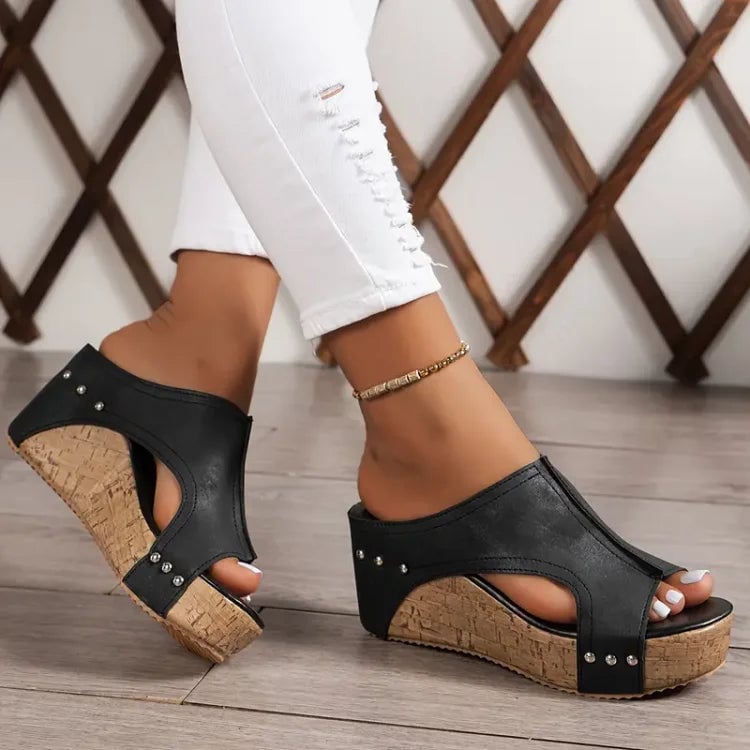 Beige Birdie cushioned sandal displayed flat to show contoured footbed detail
