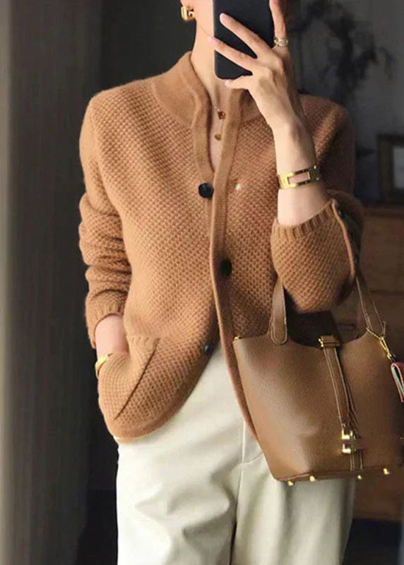 Front view of a classic button-front cardigan in a neutral tone, styled for everyday wear