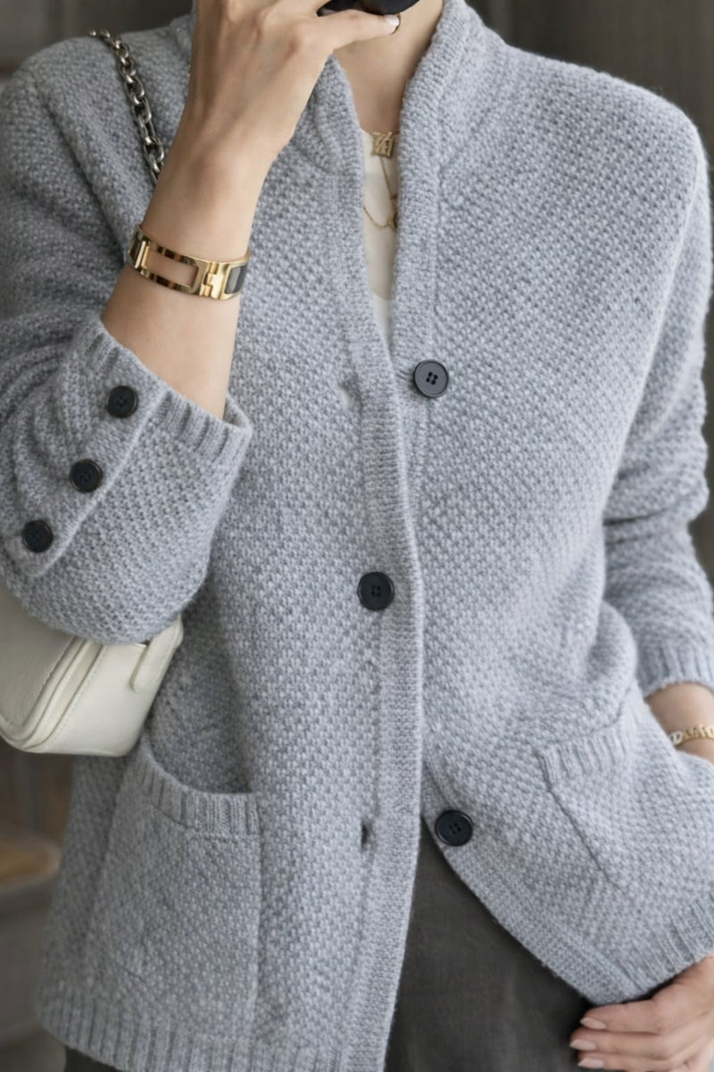 Close-up detail of refined buttons on a soft, breathable women's cardigan