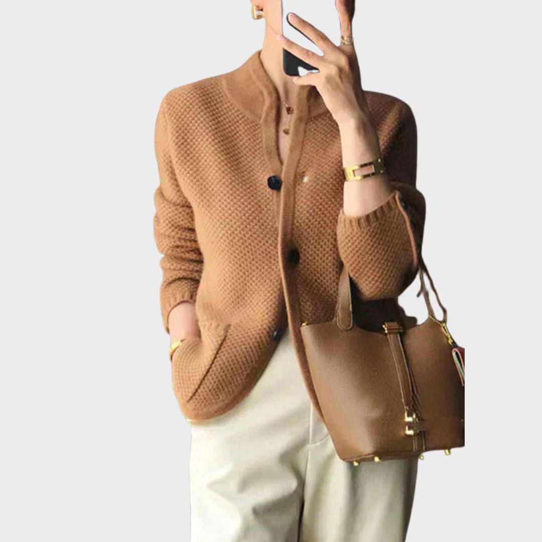 Woman layering an elegant cardigan over a casual outfit for a polished look