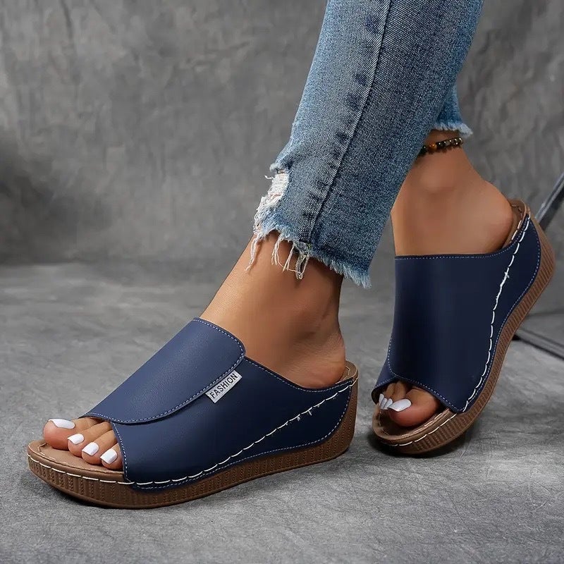 Pair of Blair arch support shoes in brown styled with casual trousers, lifestyle shot