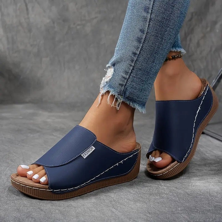 Pair of Blair arch support shoes in brown styled with casual trousers, lifestyle shot