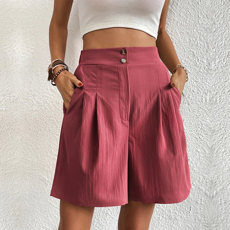Side view of Blair wide-leg pleated shorts showing deep side pocket detail in black