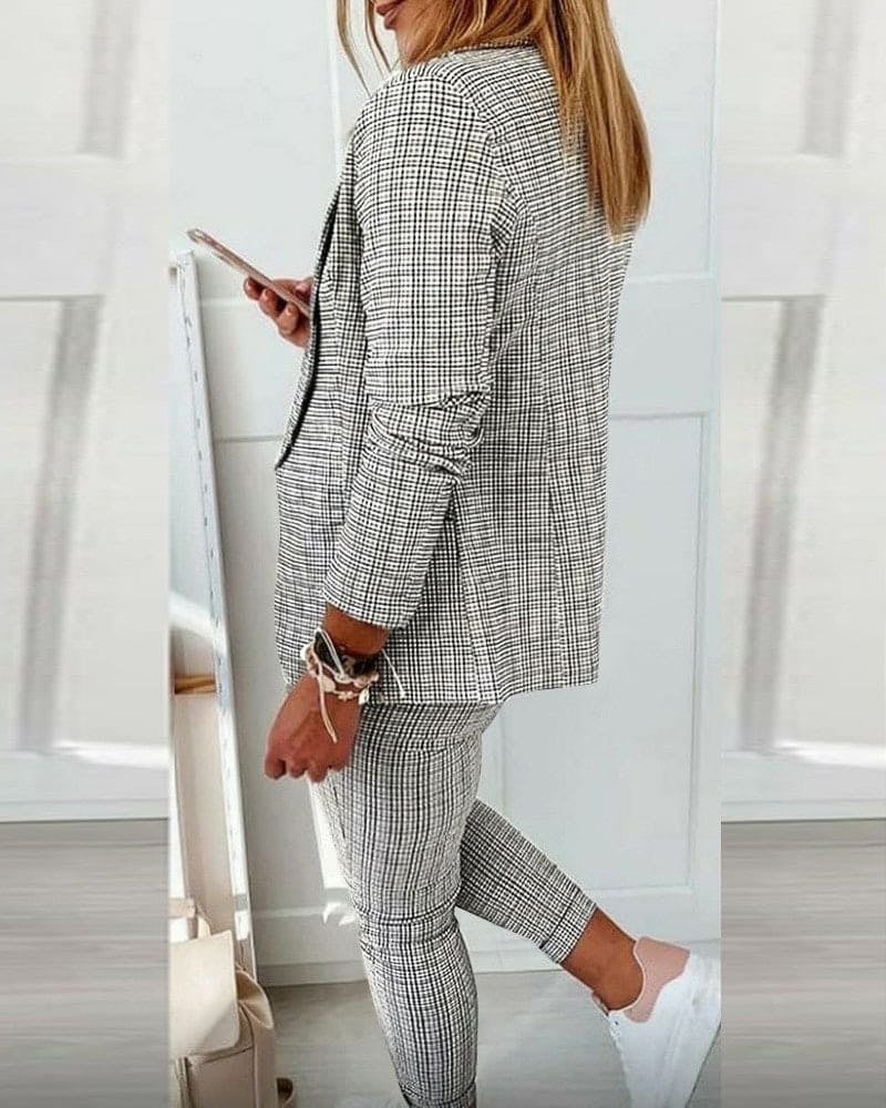 Detail shot of clean lapel and long sleeves on the structured blazer