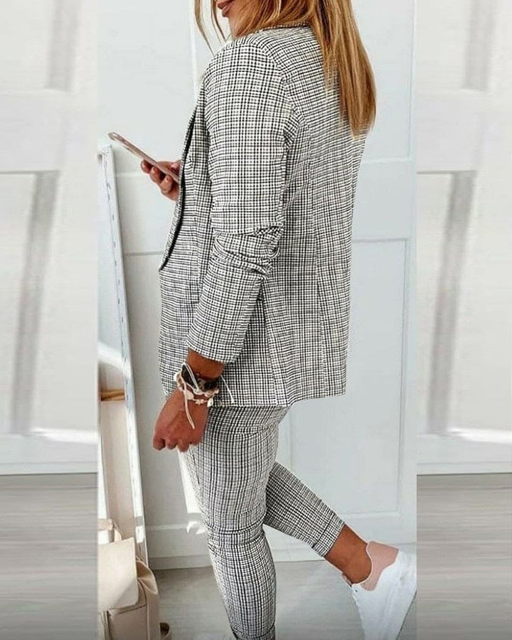 Detail shot of clean lapel and long sleeves on the structured blazer