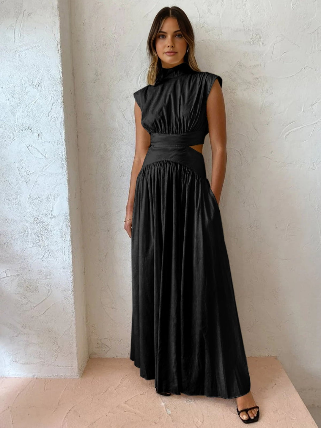 White mock neck cutout maxi dress showing side cutout waist detail