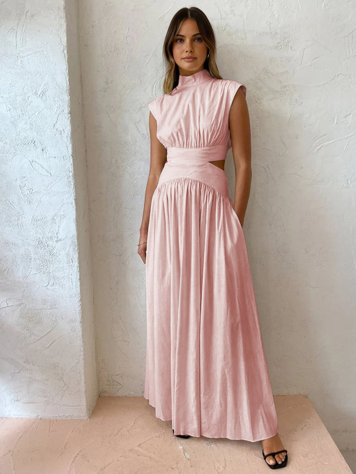 White cutout maxi dress back view with sweeping gathered skirt