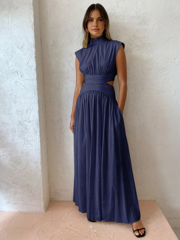 Black cutout maxi dress side view highlighting waist cutout detail