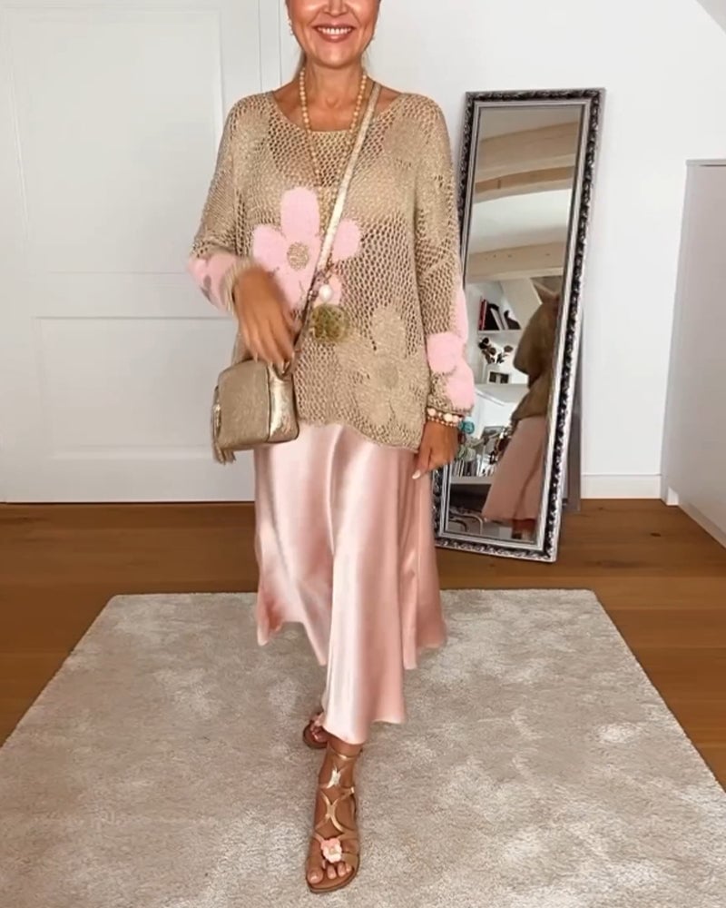 Model wearing the Bloom crochet top in pink layered over a white camisole with jeans