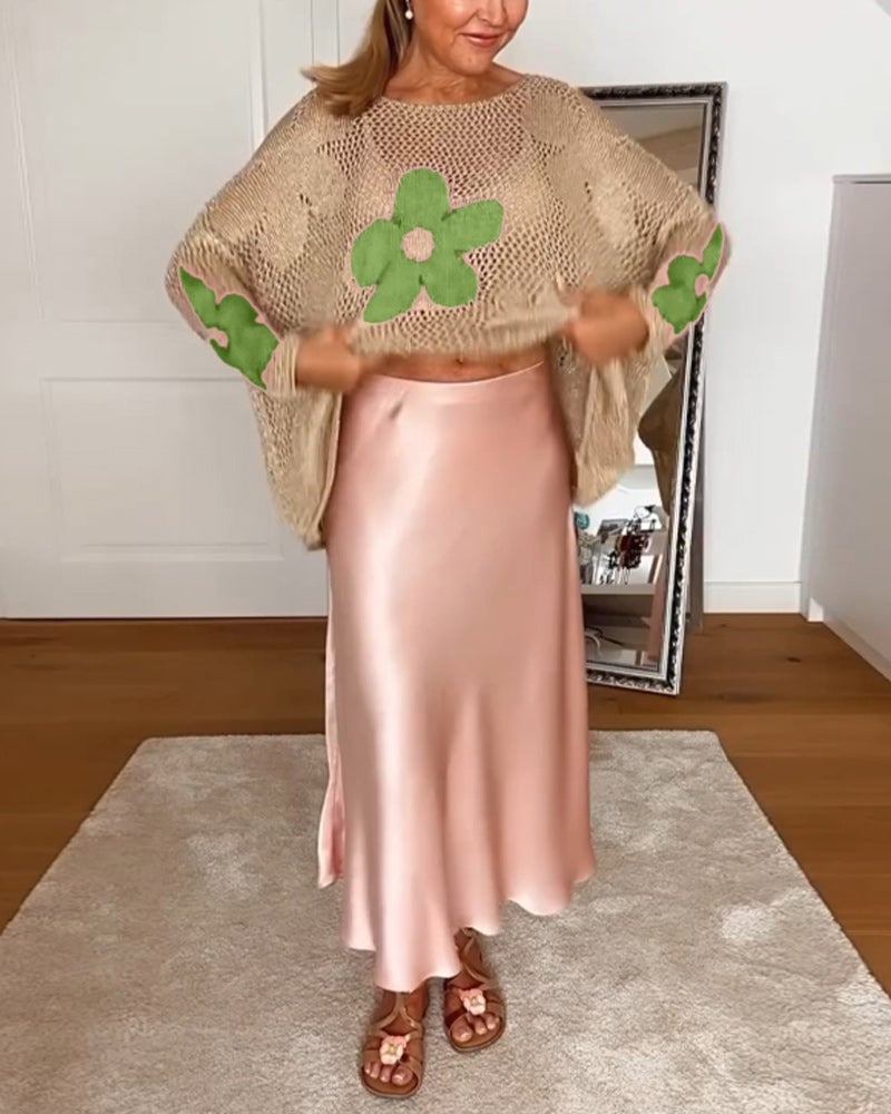 Side view of the Bloom crochet top in green highlighting the drop-shoulder design