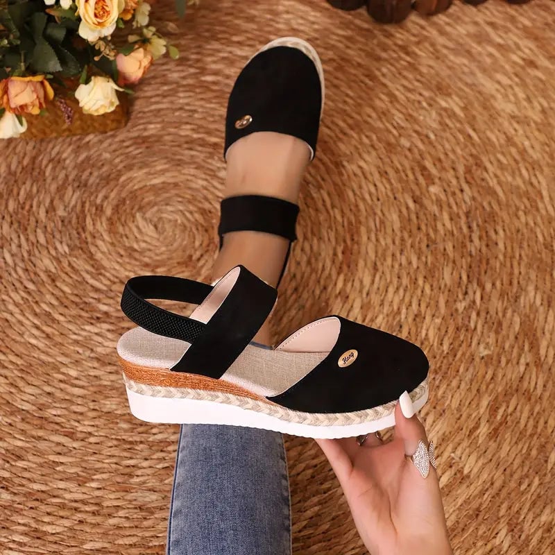 Blossom orthopedic platform sandal in black, angled front view showing cushioned sole