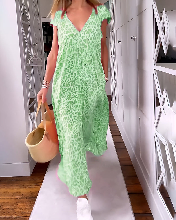 Flat lay of a V-neck printed maxi dress showing color and print detail