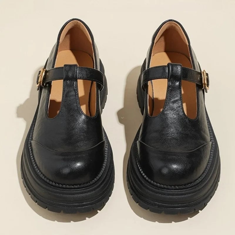 Blythe T-bar mary jane shoes in black with brogue wingtip detail and round toe, front view