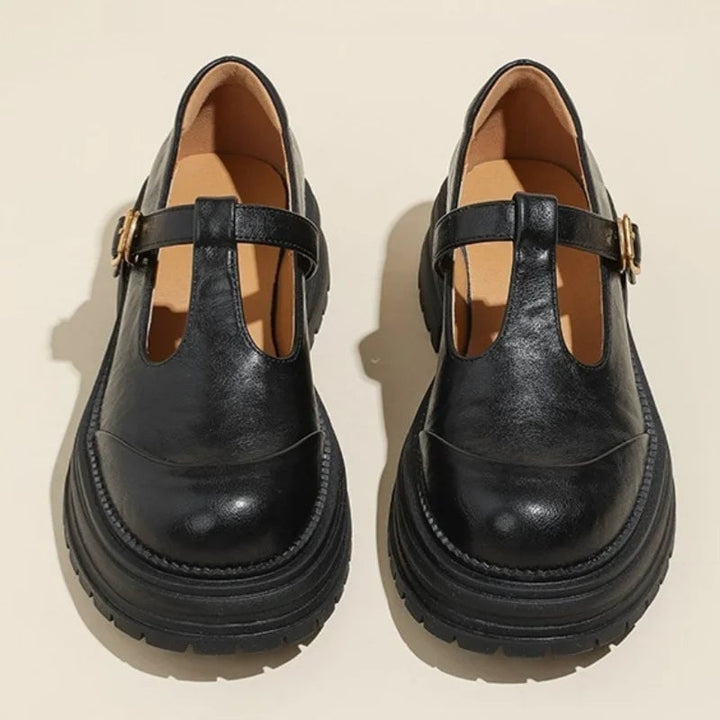 Blythe T-bar mary jane shoes in black with brogue wingtip detail and round toe, front view