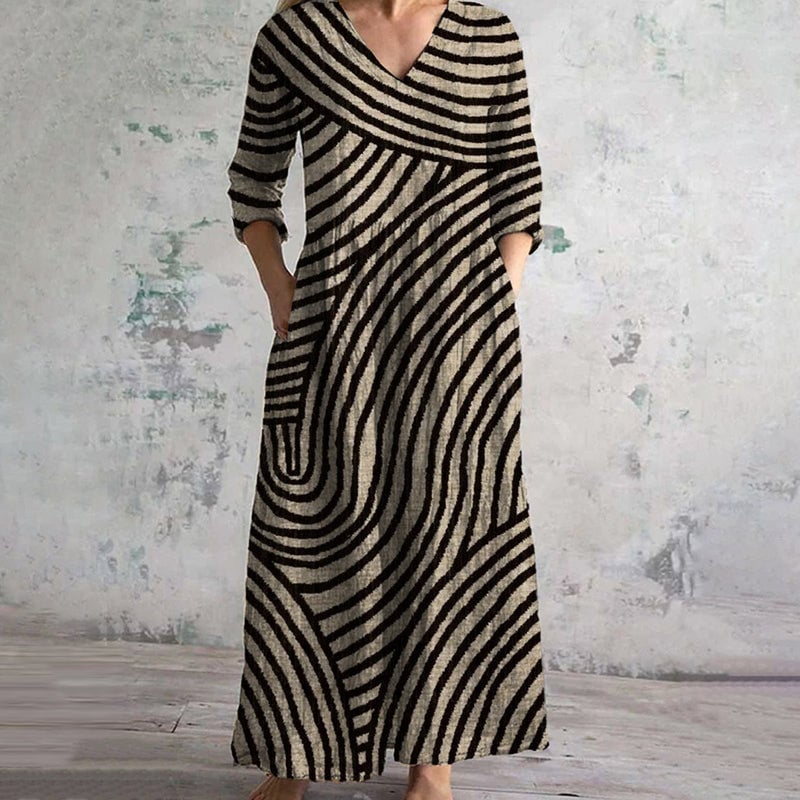 Full-length view of a vintage striped dress in brown and black showing the relaxed fit and hidden side pockets