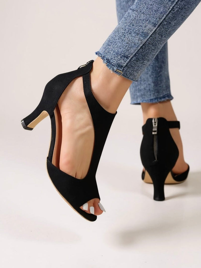 Bree cutout block heel sandals in black, front three-quarter view showing cutout detailing and stable block heel