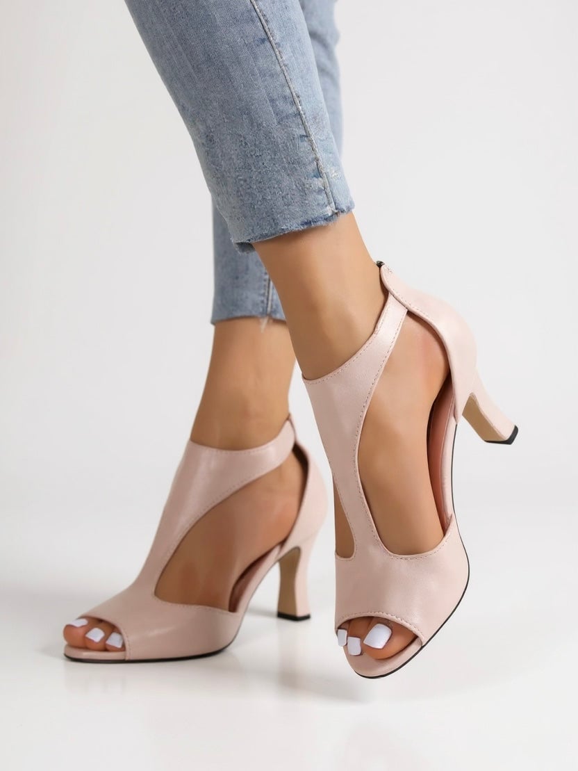 Bree cutout block heel sandals in pink, front three-quarter view with cutout accents and block heel
