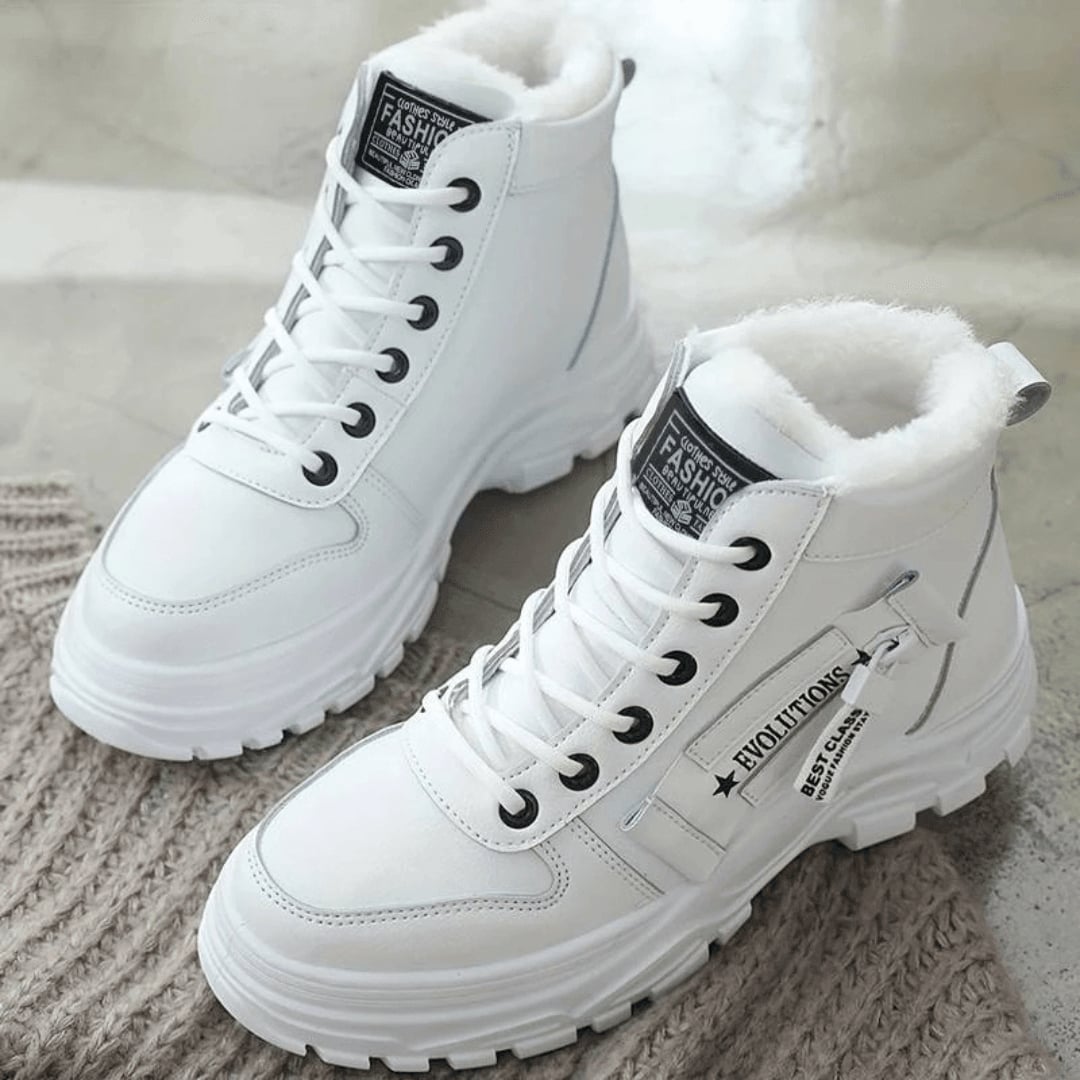 Close-up side view of women's insulated winter boot highlighting the waterproof exterior and rubber sole