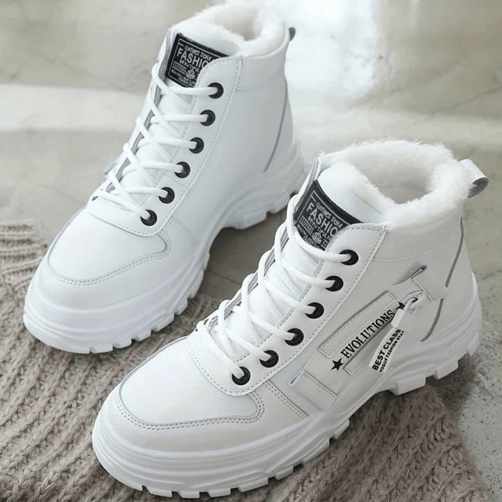 Close-up side view of women's insulated winter boot highlighting the waterproof exterior and rubber sole