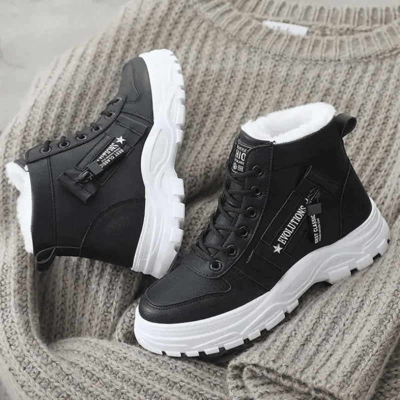 Women's winter boot displayed showing the plush insulated lining interior detail