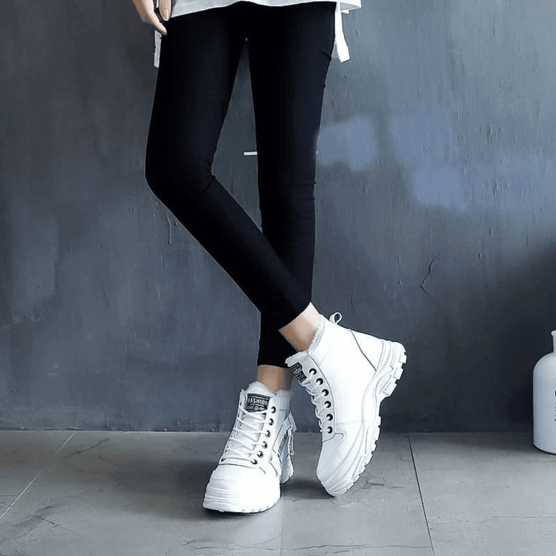 Flat lay of women's waterproof winter boot showing the anti-slip rubber outsole tread