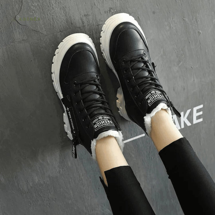 Overhead product shot of women's winter boot showing clean silhouette and sleek modern design