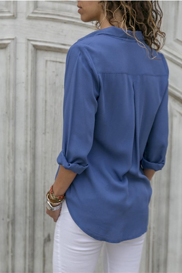Model wearing the Breezy collared blouse tucked into tailored trousers for a polished work outfit