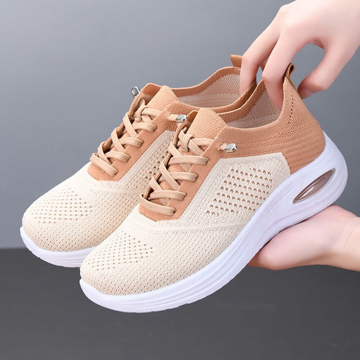 Women's beige mesh lace-up sneakers with visible air cushion heel and white platform sole