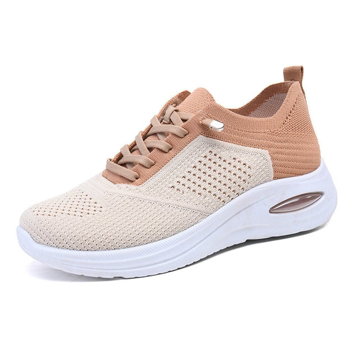 Overhead flat-lay of women's gray mesh air cushion walking sneakers with flat laces