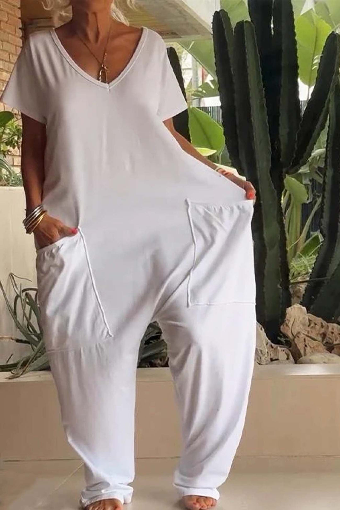 Flat lay of the Breezy short sleeve jumpsuit in multiple colors showing the relaxed silhouette